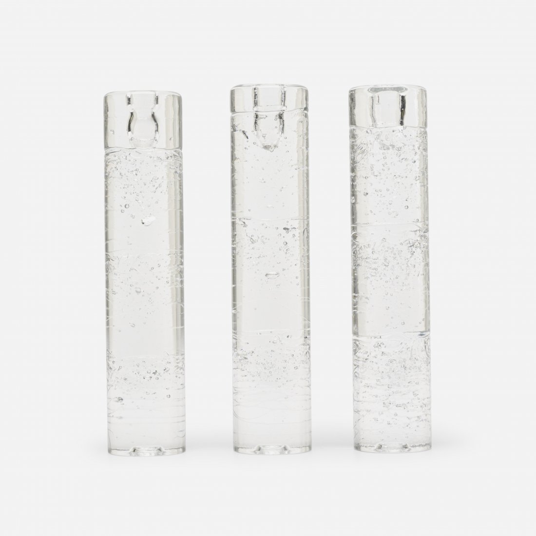 Timo Sarpaneva Archipelago sculptures: Timo Sarpaneva Archipelago sculptures, set of three Ittala Finland, 1978 glass 2.5 dia x 11.5 h inches Signed with decal manufacturer's label to one example: [i Made In Finland]. Literature: Sarpaneva