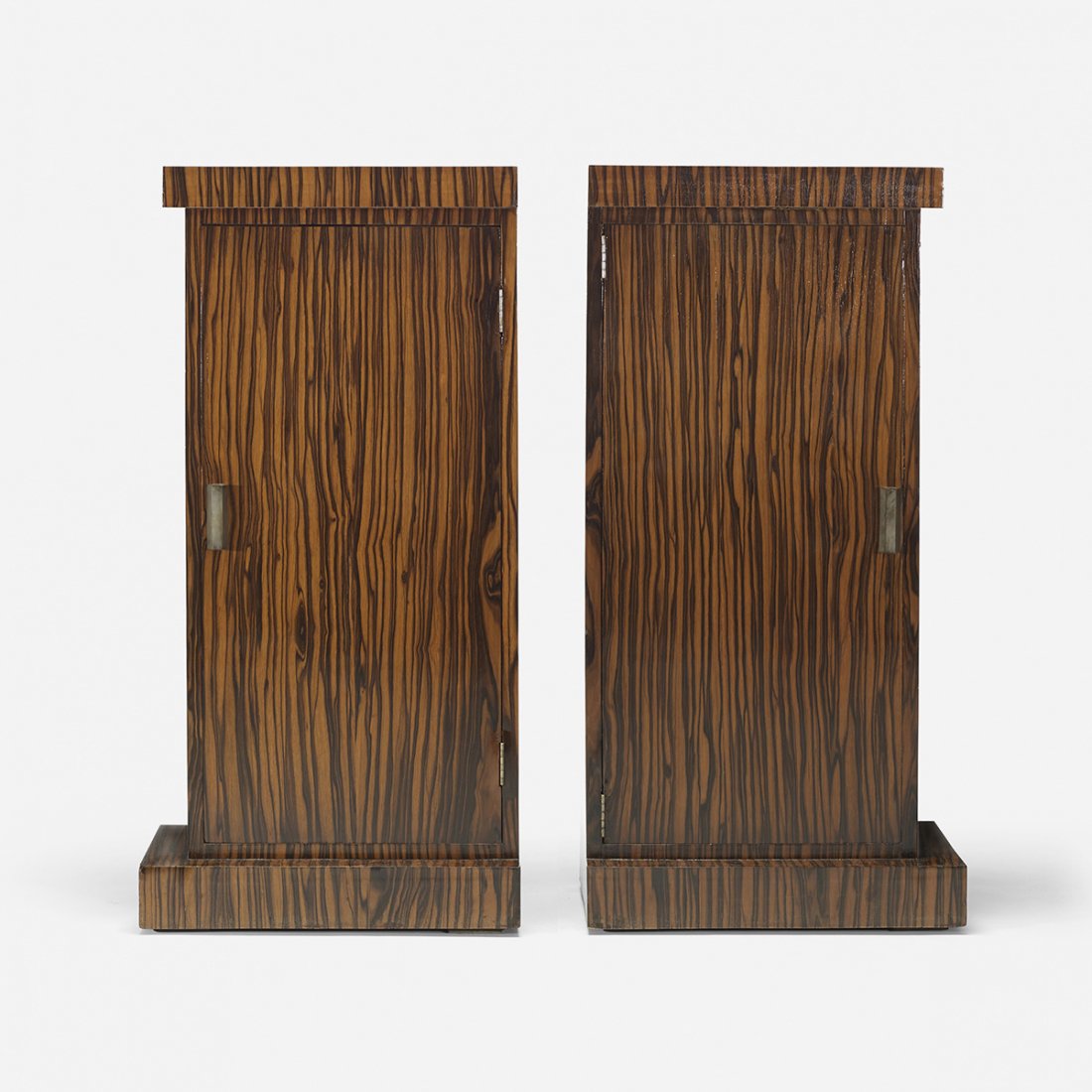 Art Deco nightstands, pair: Art Deco nightstands, pair France, c. 1940 macassar ebony, nickel-plated brass 18 w x 13.25 d x 36.5 h inches Each nightstand features one door concealing one adjustable shelf.