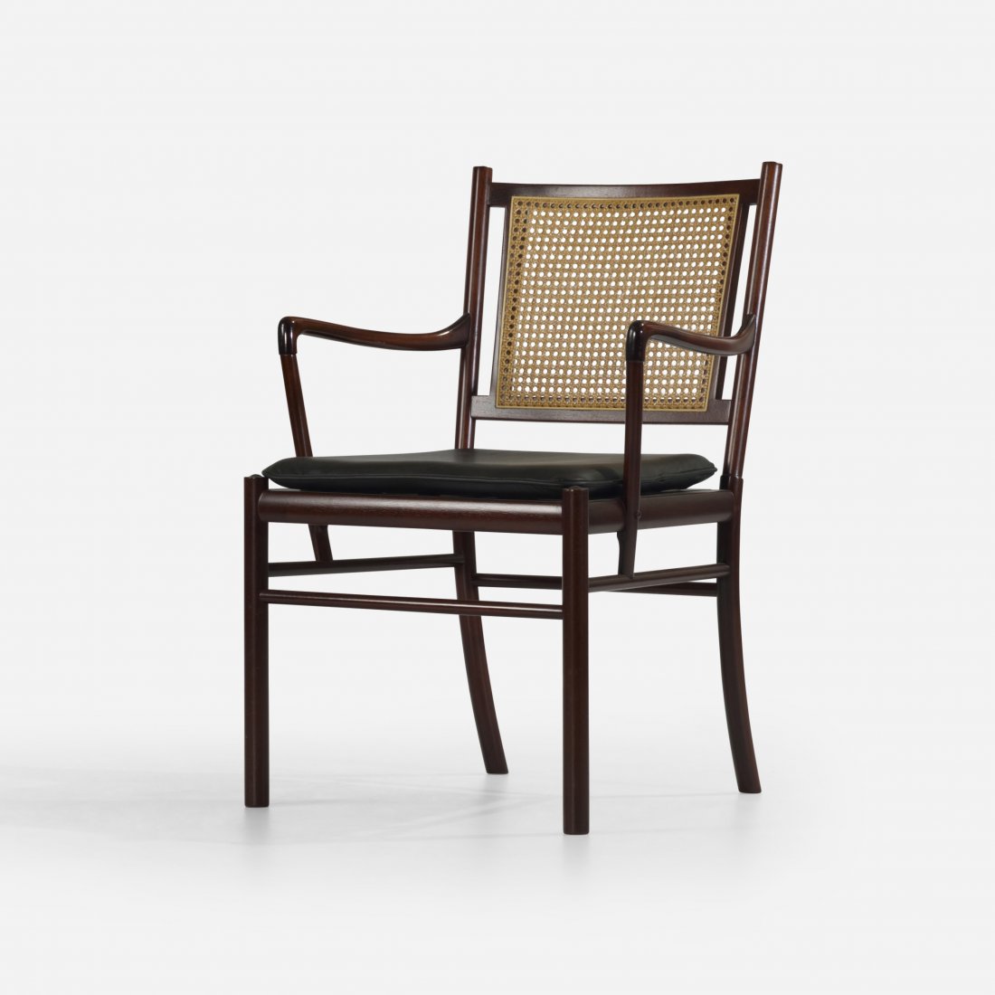 Ole Wanscher armchair: Ole Wanscher armchair Poul Jeppesen Denmark, c. 1960 mahogany, leather, cane 23 w x 22.5 d x 33.5 h inches Signed with decal manufacturer's label to underside: [PJ Danmark P. Jeppesen MÃ¸belfabrik A