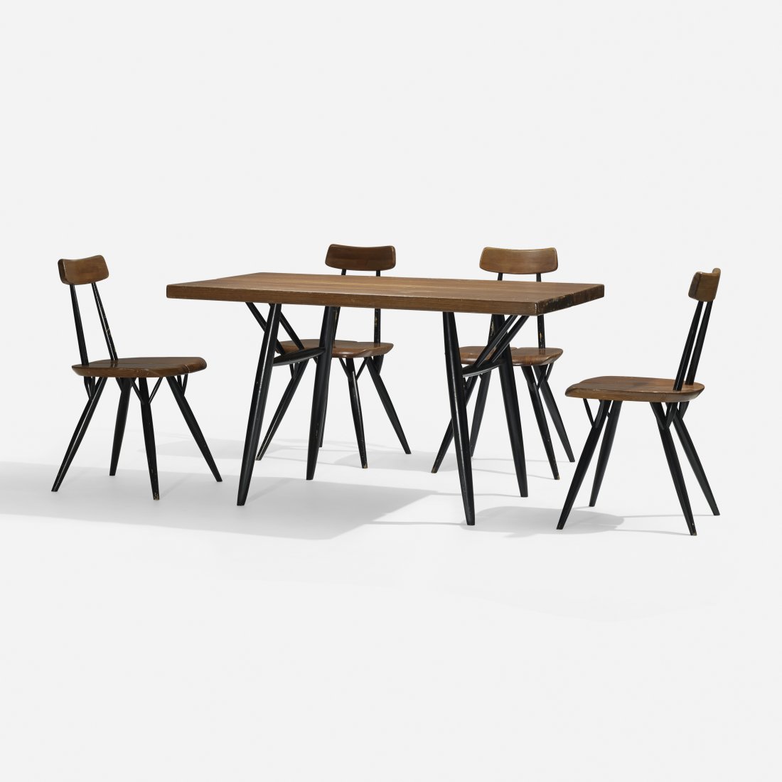 Ilmari Tapiovaara Pirkka dining set: Ilmari Tapiovaara Pirkka dining set Laukaan Puu Finland, 1955 stained pine, lacquered wood 47 w x 27.5 d x 27 h inches Set includes table and set of four chairs; chairs measure: 17.75 w x 17 d x 30 h