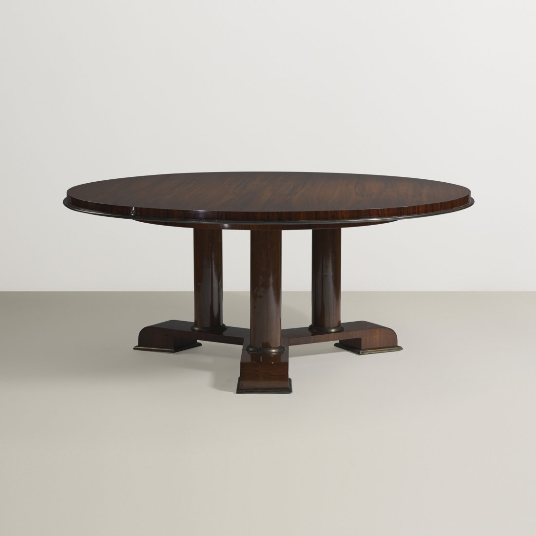 Jean Royère dining table: Jean Royère dining table France, c. 1955 rosewood, brass 67.5 dia x 27.75 h inches This work is documented in the Royère archives. Provenance: Private collection, Lima, Peru | Galerie Jacques Lacost