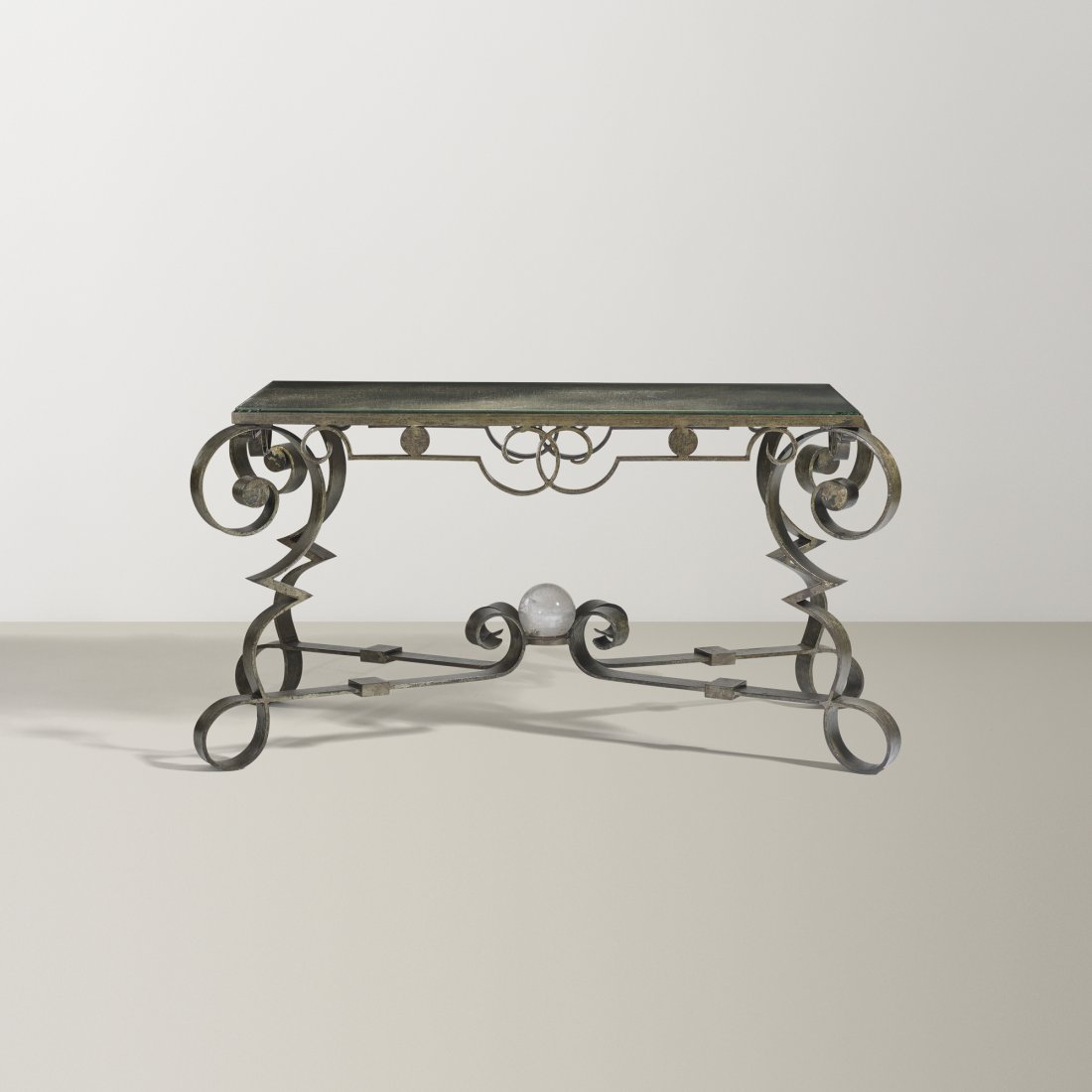 French table: French table La Ferronnerie d'Art et de B'¢timent c. 1940 wrought iron, mirrored glass, crystal 46 w x 23.5 d x 23.25 h inches Literature: Le Fer Forgé Dans La Maison, Robert, pg.25