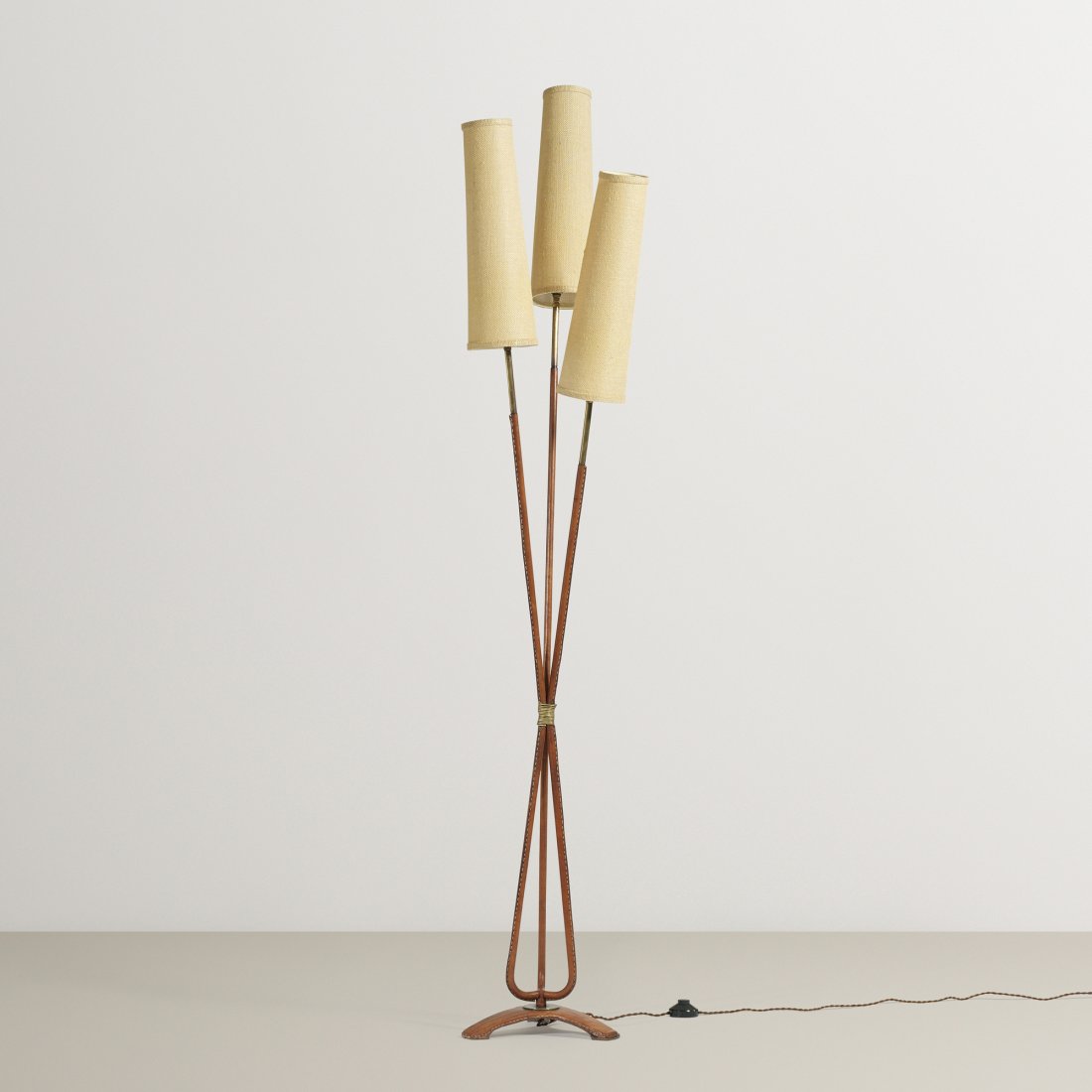 Jacques Adnet floor lamp: Jacques Adnet floor lamp France, c. 1950 saddle-stitched leather, brass, linen 11 w x 16 d x 73.5 h inches
