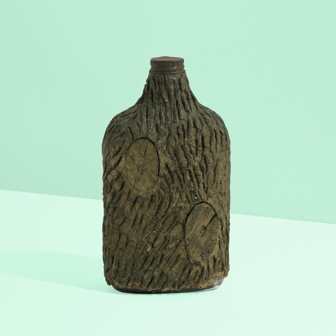 Folk Art whiskey bottle: Folk Art whiskey bottle USA, c. 1925 lacquered resin, lacquered wood, glass, steel 4.25 w x 2.5 d x 7.5 h inches