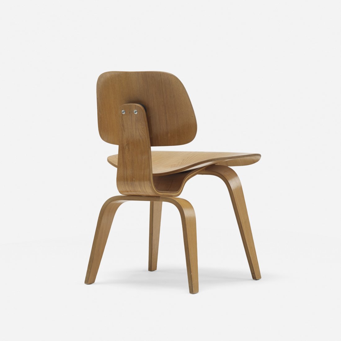 Charles and Ray Eames DCW: Charles and Ray Eames DCW Herman Miller USA, 1945/1950 ash, rubber 19.5 w x 21 d x 28.75 h inches Signed with impressed manufacturer's mark to underside: [DCW]. Literature: Eames Design: The Work of t