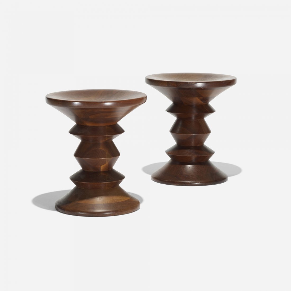 Charles and Ray Eames Time Life stools, pair: Charles and Ray Eames Time Life stools, pair Herman Miller USA, 1960 walnut 13 dia x 14.75 h inches Literature: Eames Design: The Work of the Office of Charles and Ray Eames, Neuhart, Neuhart and Eame