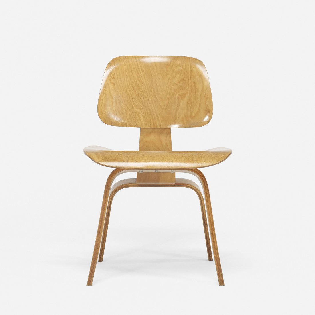 Charles and Ray Eames DCW: Charles and Ray Eames DCW Evans Products/Herman Miller USA, 1945/1948 birch plywood, rubber 19.5 w x 21 d x 28.75 h inches Signed with partial paper manufacturer’s label to underside: [Herman Miller