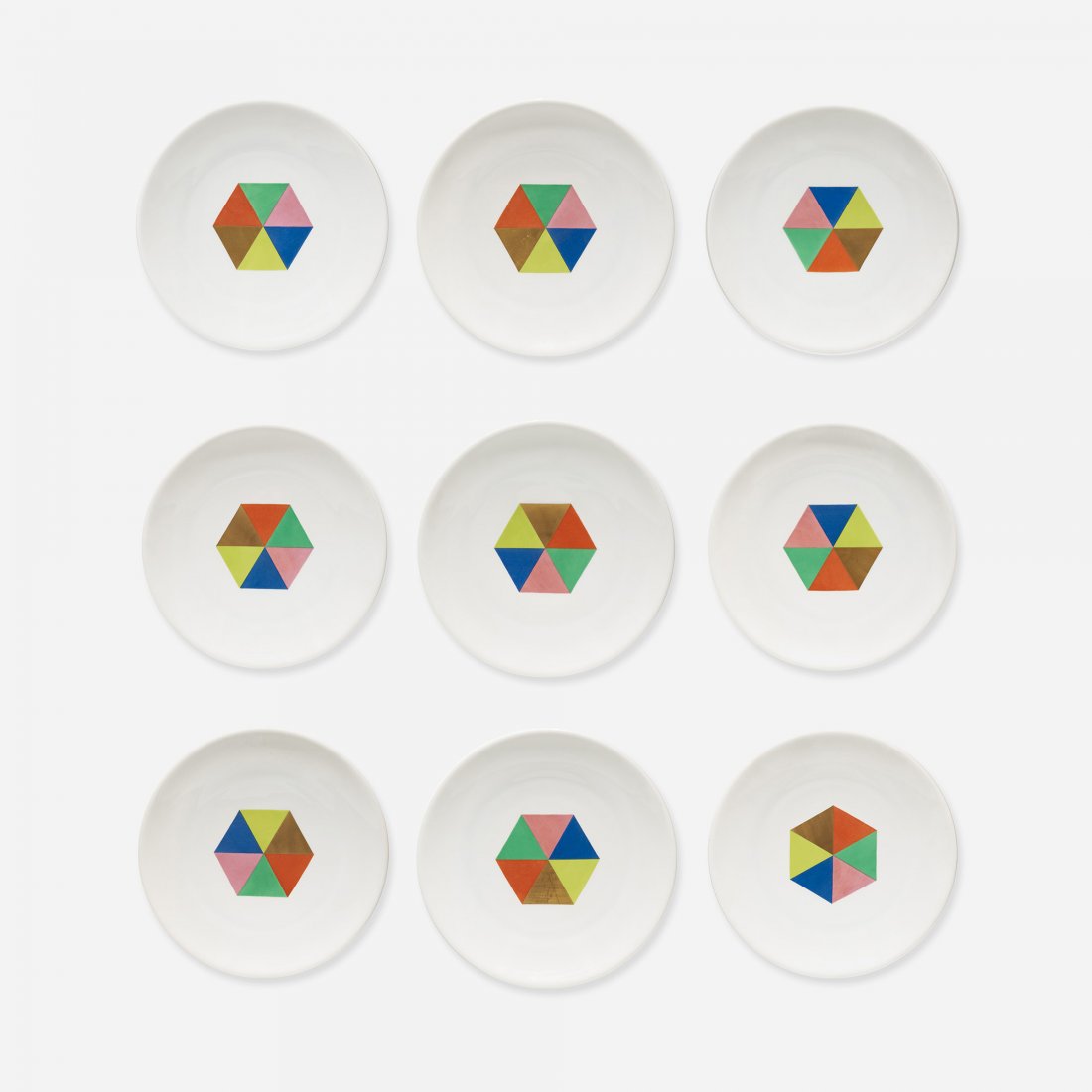 Alexander Girard Carolus Magnus plates, set of nine: Alexander Girard Carolus Magnus plates, set of nine Hutschenreuther for Georg Jensen USA, c. 1956 glazed porcelain with applied decoration 10.75 dia x 1.25 h inches Signed with stamped manufacturer's 