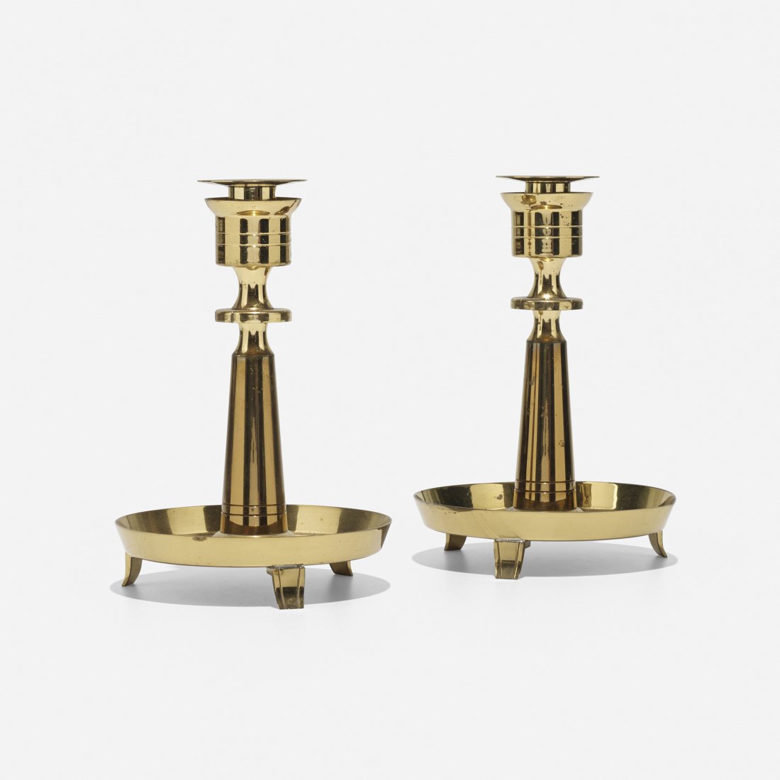Tommi Parzinger pair of custom candlesticks: Tommi Parzinger pair of custom candlesticks from the Appleman Commission Dorlyn Silversmiths USA, 1956 brass 6.5 dia x 9.5 h inches Signed with impressed manufacturer's mark to each example: [Made by 