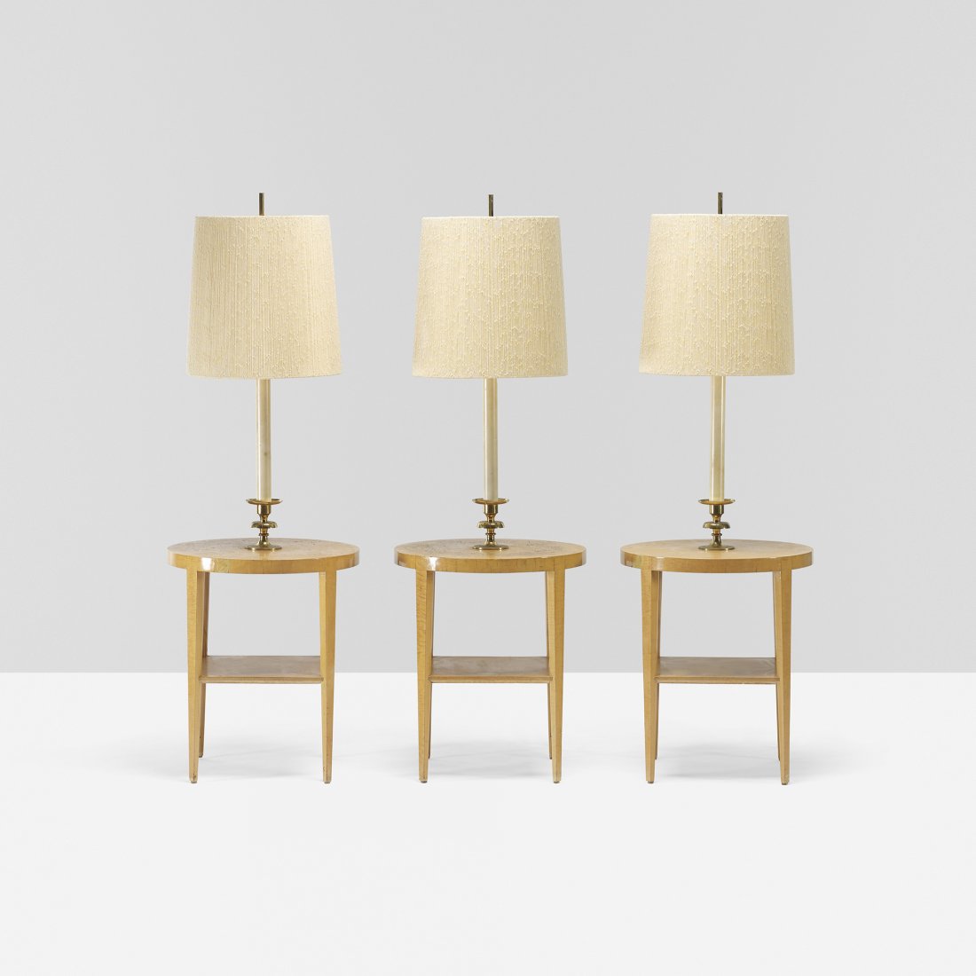 Tommi Parzinger set of three custom lamp tables: Tommi Parzinger set of three custom lamp tables from the Appleman Commission Parzinger Originals USA, 1956 curly maple, brass, enameled aluminum, string over linen 19 dia x 57.5 h inches Signed with b