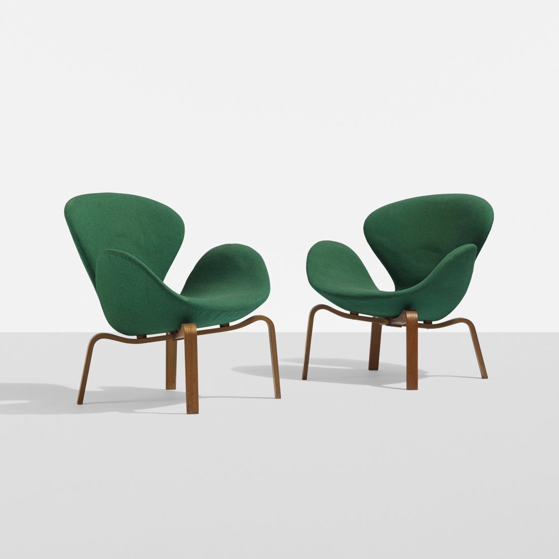 Arne Jacobsen Swan chairs, pair: Arne Jacobsen Swan chairs, pair Fritz Hansen Denmark, 1958 upholstery, laminated teak 28.75 w x 26.5 d x 29.75 h inches Signed with decal manufacturer's label to underside of each example: [FH Made in