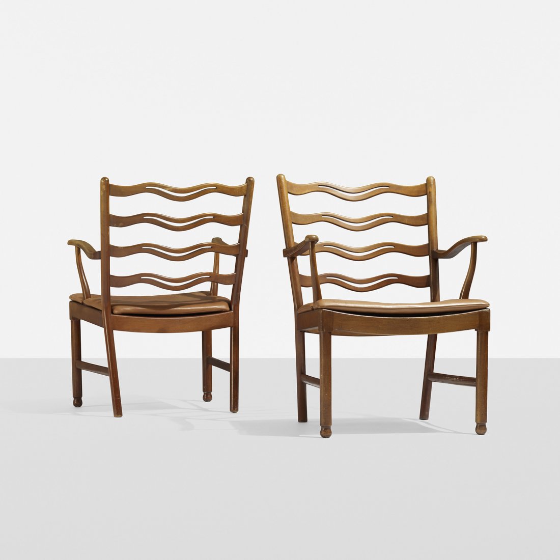 Ole Wanscher lounge chairs, pair: Ole Wanscher lounge chairs, pair Fritz Hansen Denmark, 1944 beech, leather 24 w x 26 d x 33.75 h inches Signed with stamped manufacturer's mark to each example: [FH]. Literature: Moderne Dansk Boligku