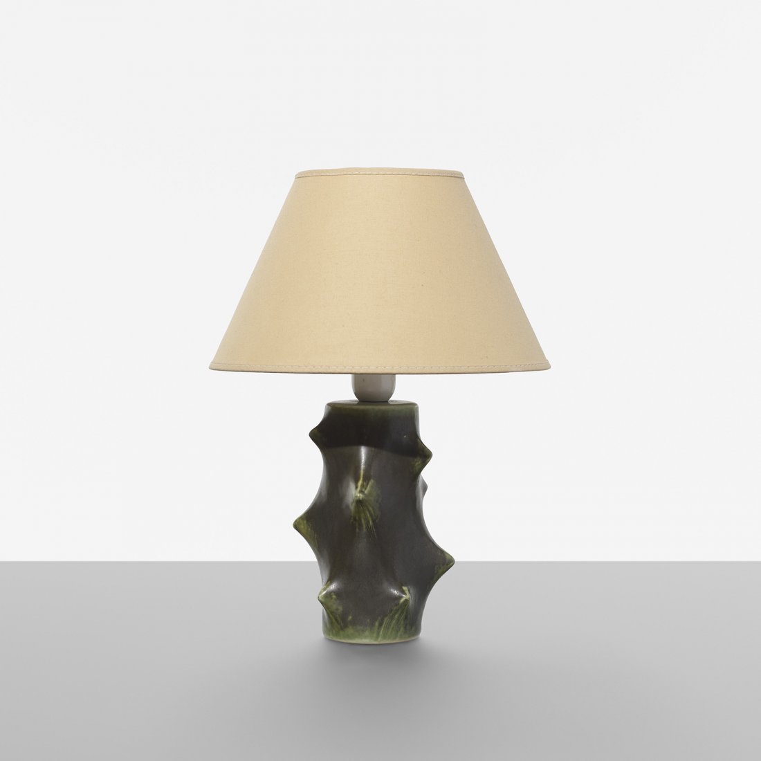 Knud Basse table lamp: Knud Basse table lamp Michael Andersen & Son Denmark, c. 1955 glazed stoneware, linen, plastic 10 dia x 13.5 h inches Signed with studio cipher to underside.