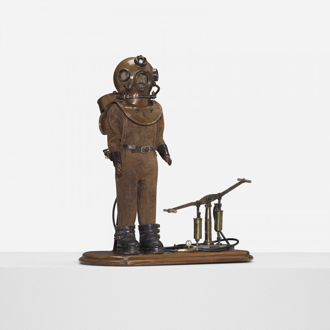 19th Century deep sea diver model: 19th Century deep sea diver model walnut, brass, canvas, steel, leather, glass 14 w x 6.5 d x 14.75 h inches Model features hand operated air pump. Signed with museum inventory number: [87.11420]. Pro