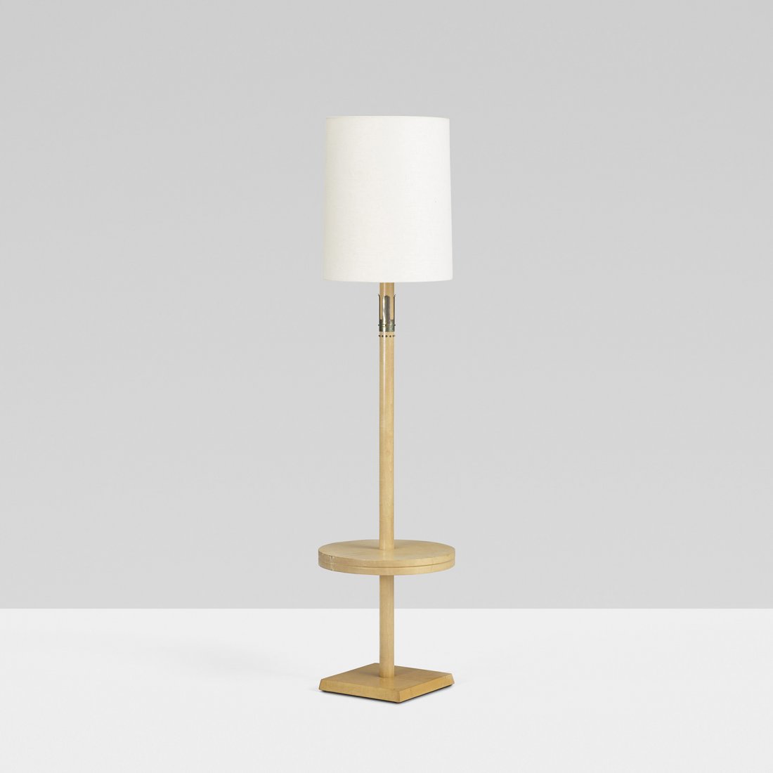 Tommi Parzinger floor lamp: Tommi Parzinger floor lamp Parzinger Originals USA, c. 1955 maple, linen, brass 16.25 dia x 66.5 h inches Signed with branded manufacturer's mark to underside: [Parzinger Originals]. Provenance: Jean 