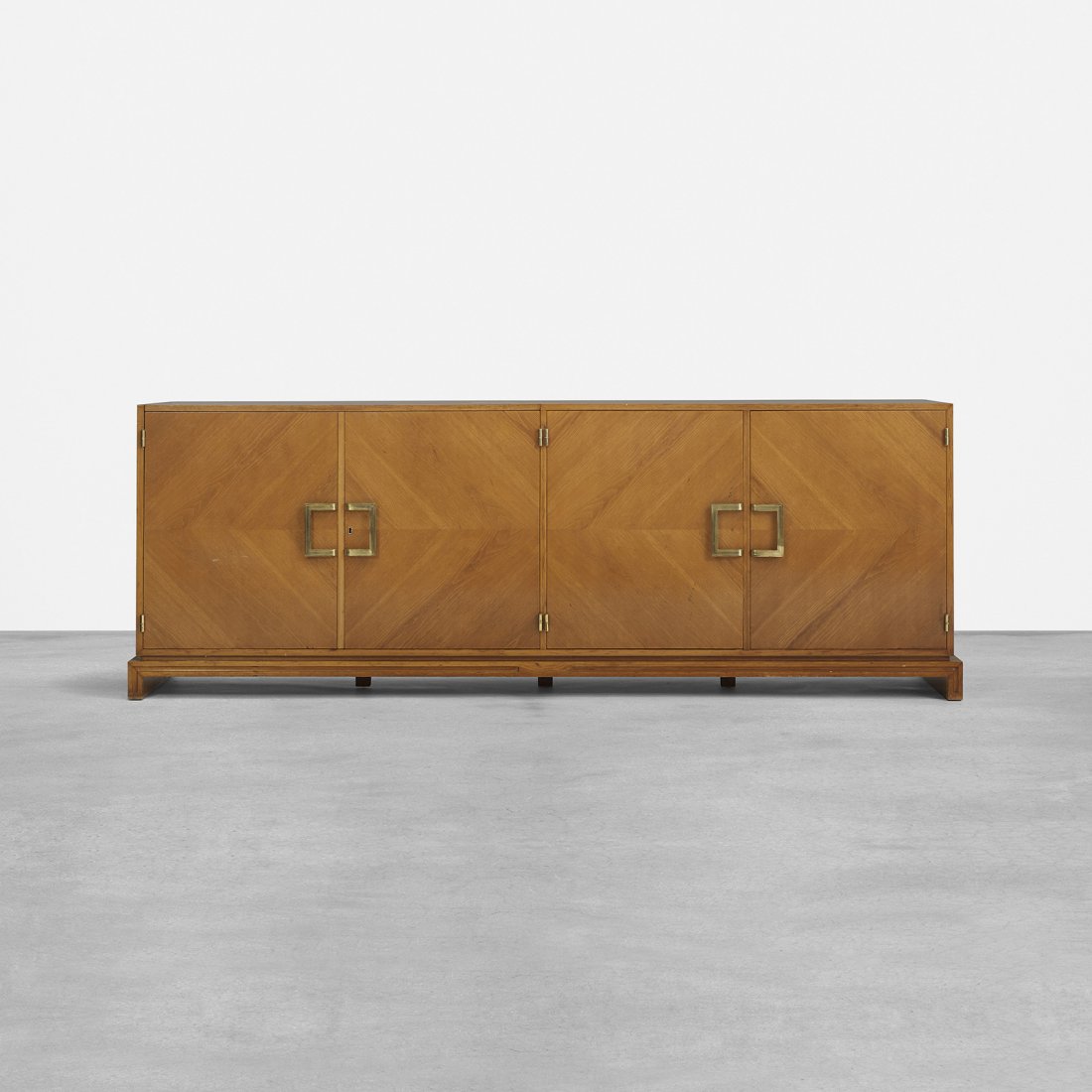 Tommi Parzinger cabinet: Tommi Parzinger cabinet Parzinger Originals USA, c. 1955 walnut, brass 98 w x 23.5 d x 34 h inches Cabinet features four doors concealing eight drawers, flip-up top concealing bar, storage compartment