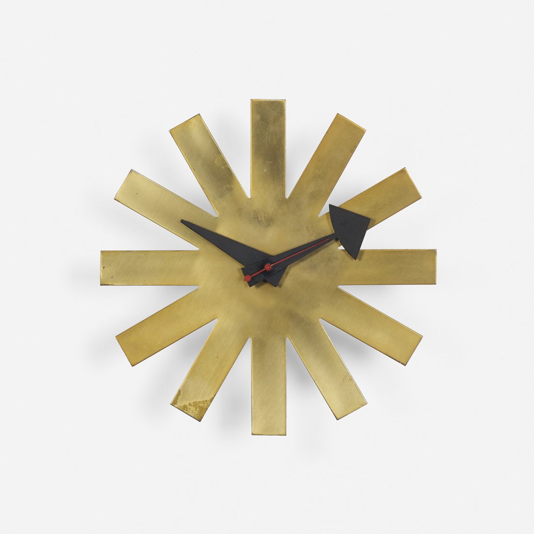 George Nelson & Associates Asterisk wall clock: George Nelson & Associates Asterisk wall clock, model 2213 Howard Miller Clock Company USA, c. 1953 brass, enameled aluminum, birch 10 dia x 29.5 h inches Signed with decal manufacturer’s label: [Ho