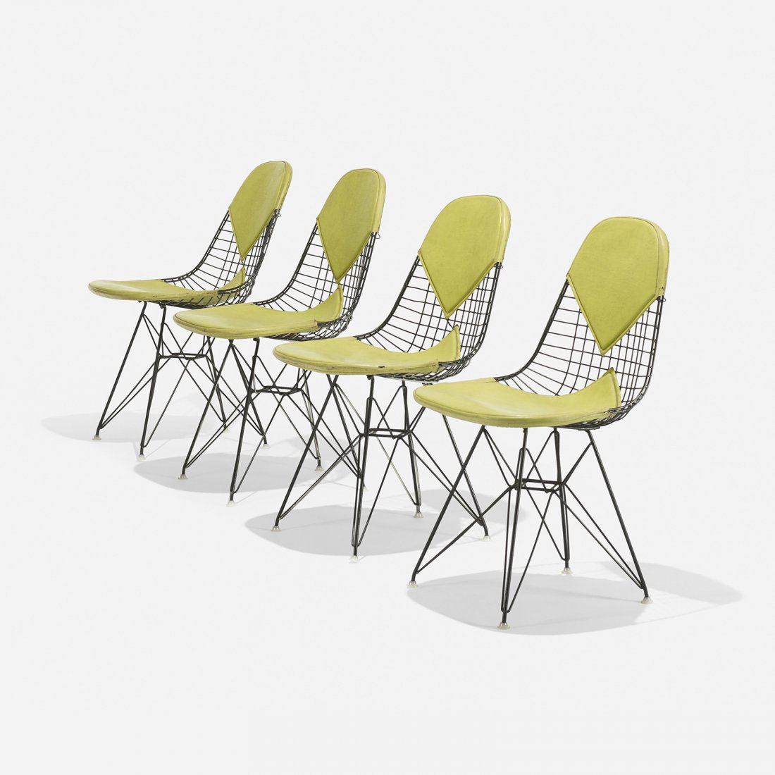 Charles and Ray Eames DKRs, set of four: Charles and Ray Eames DKRs, set of four Herman Miller USA, 1951 enameled steel, vinyl, plastic 19 w x 22.5 d x 31.5 h inches Signed with paper manufacturer's label to underside of two examples: [Herma