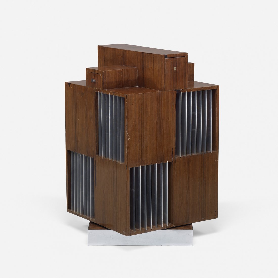 Andre Sornay rotating library cabinet: André Sornay rotating library cabinet France, c. 1955 rosewood, chrome-plated brass, aluminum 25 w x 24 d x 40 h inches Cabinet features four drawers and eight divided shelves.