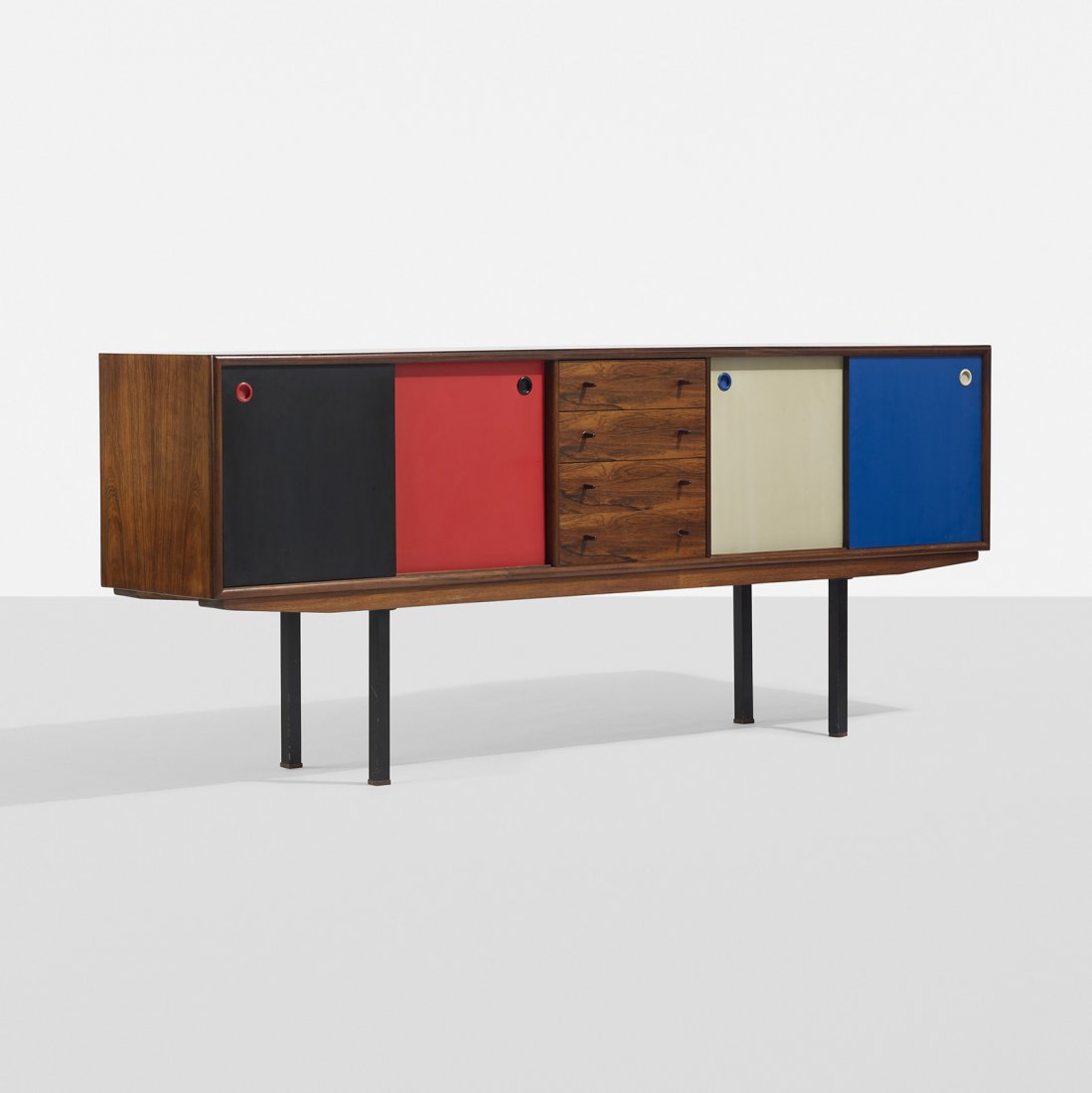 Arne Vodder cabinet: Arne Vodder cabinet Sibast Mobler Denmark, c. 1960 rosewood, lacquered wood, enameled steel 82.75 w x 18 d x 34.5 h inches Cabinet features four sliding doors, three adjustable shelves and four drawer