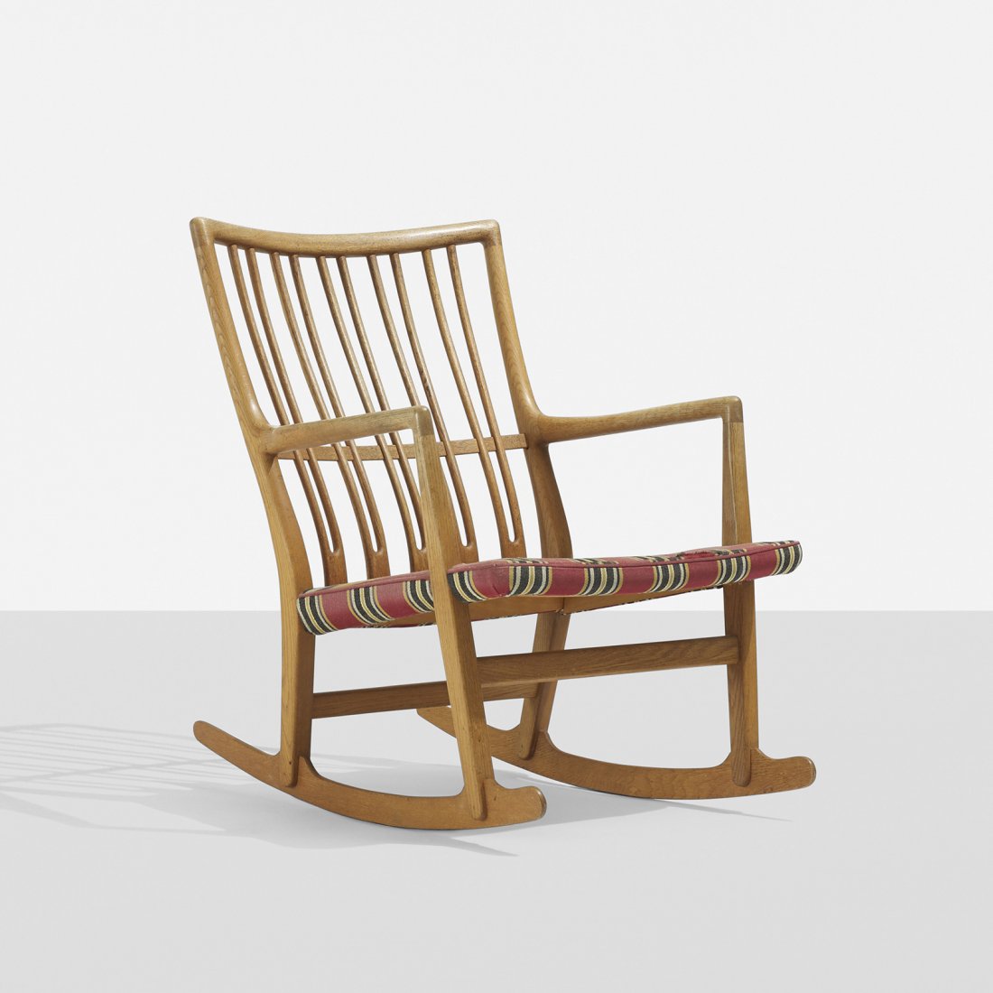 Hans Wegner rocking chair: Hans Wegner rocking chair Mikael Laursen Denmark, 1945 oak, upholstery 24.5 w x 28 d x 31.5 h inches Literature: Hans J. Wegner's 100 Chairs, Oda, pg. 18