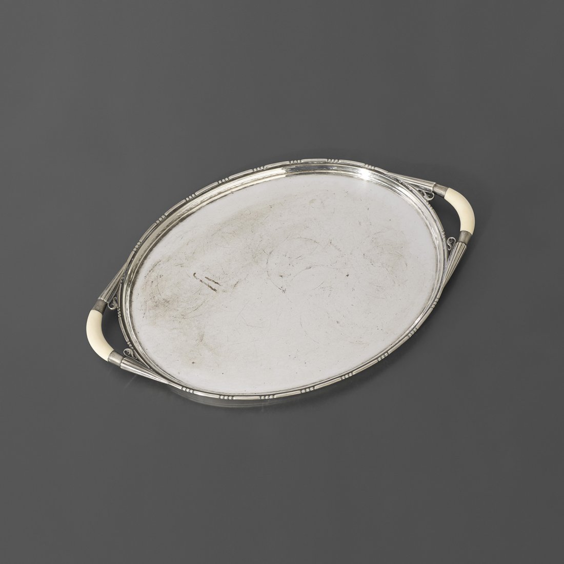 Johan Rohde tray: Johan Rohde tray Georg Jensen Denmark, 1917 sterling silver, bone 14.5 w x 9.5 d x .5 h inches Signed with impressed manufacturer's mark to edge: [Georg Jensen Sterling Denmark 925]. Literature: Georg