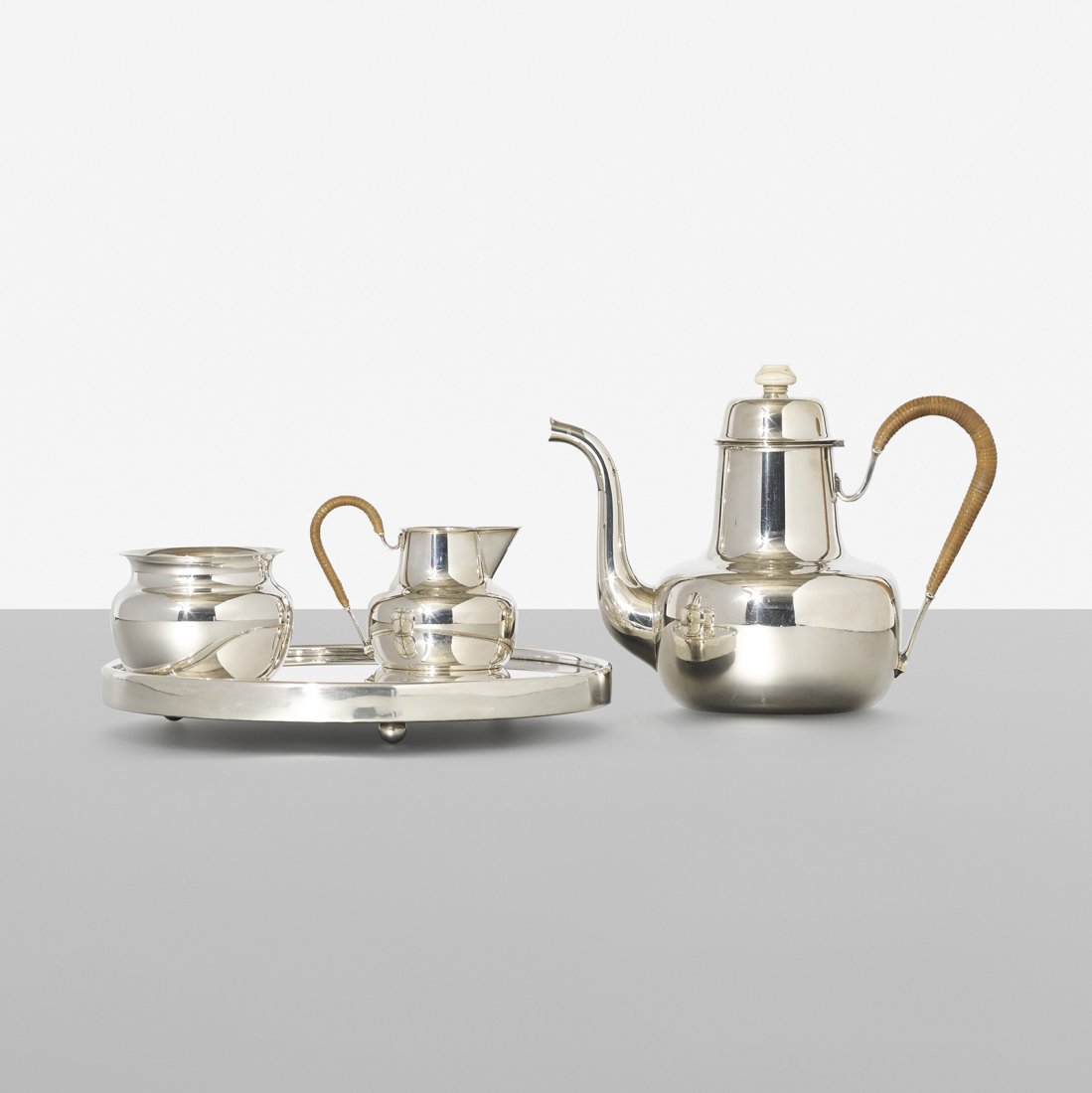 Erik Herlow coffee service: Erik Herlow coffee service A. Michelsen Denmark, c. 1960 sterling silver, cane, bone 8.5 w x 4.5 d x 6.5 h inches Service includes tray, teapot, sugar bowl and creamer. Signed with impressed marks to