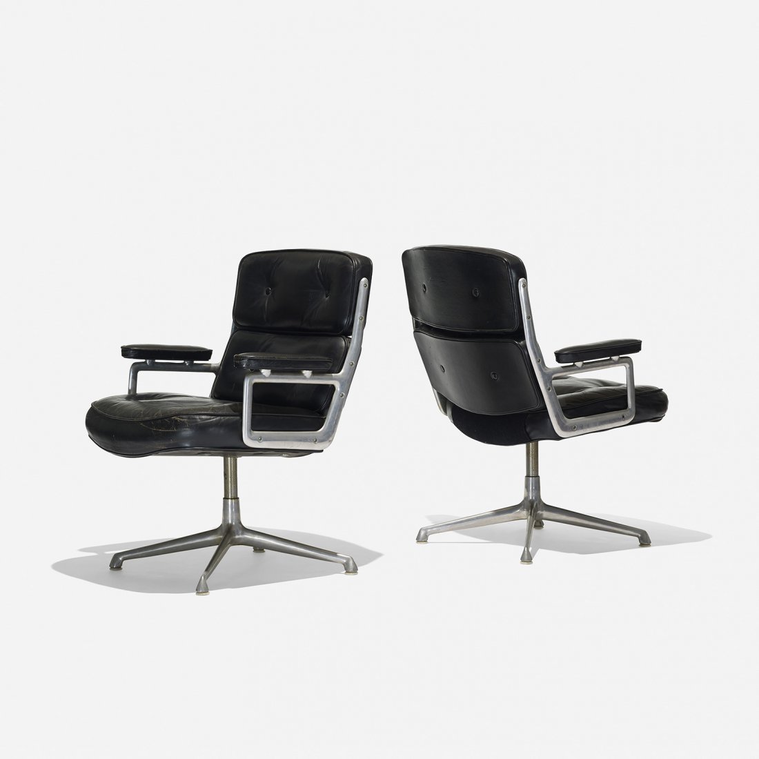 Charles and Ray Eames Time-Life armchairs, pair: Charles and Ray Eames Time-Life armchairs, pair Herman Miller USA, 1960 cast aluminum, leather, rubber, plastic 27 w x 28 d x 35 h inches Signed with disc manufacturer's label to underside of one exam