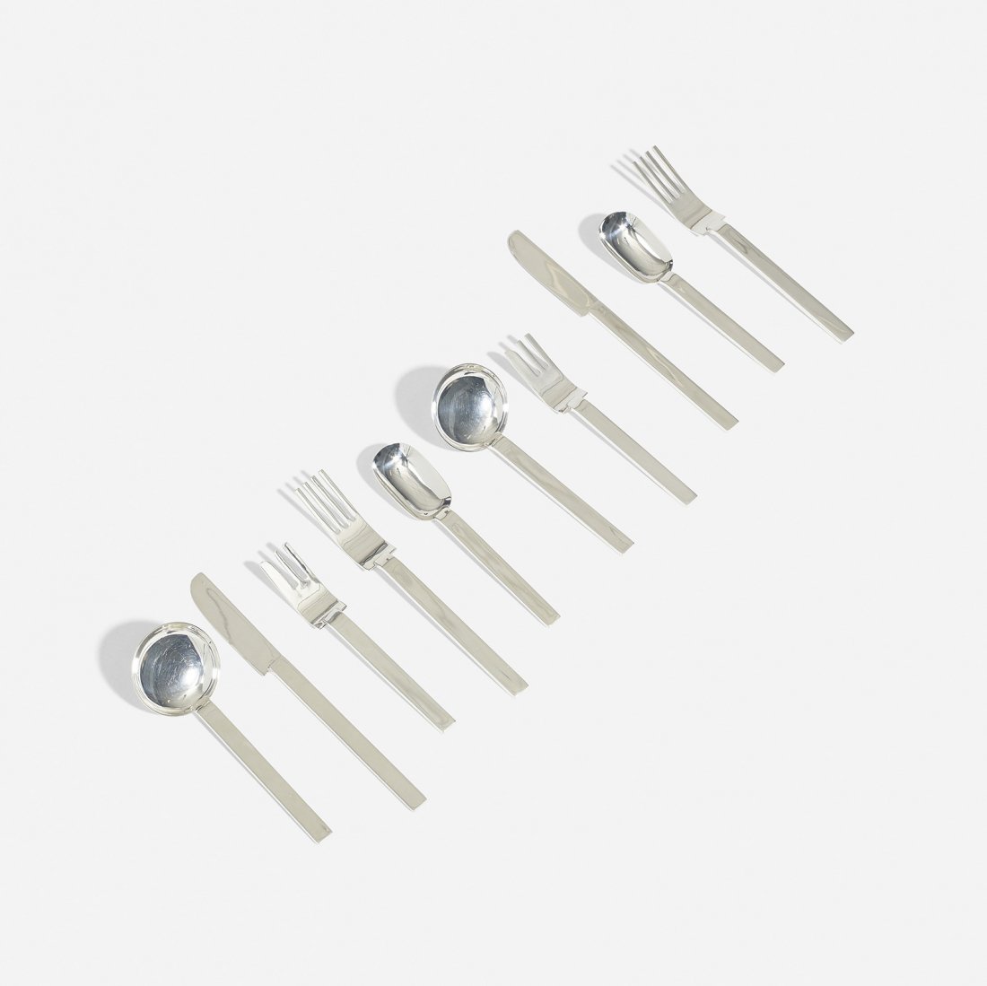 Russel Wright flatware, Metropolitan Museum of Art: Russel Wright flatware for the Metropolitan Museum of Art USA, 1933/1987 silverplate Complete five piece service for eight; forty pieces total. Signed with printed manufacturer's mark to package: [Mad