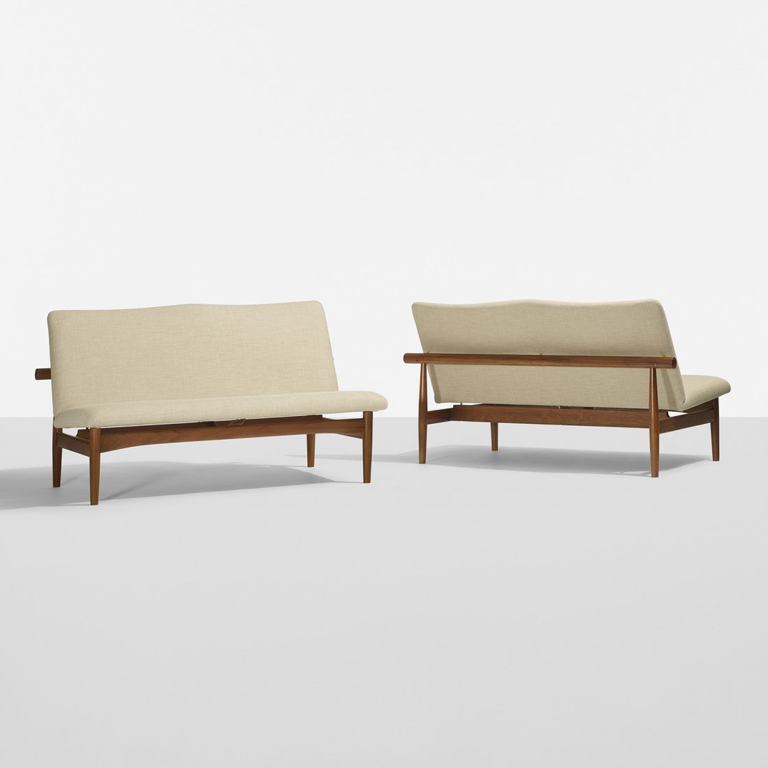 Finn Juhl settees, pair: Finn Juhl settees, pair France & Son Denmark, c. 1950 teak, upholstery, brass 50.25 w x 30 d x 29.25 h inches Signed with applied disc distributor's label to underside of each example: [John Stuart In