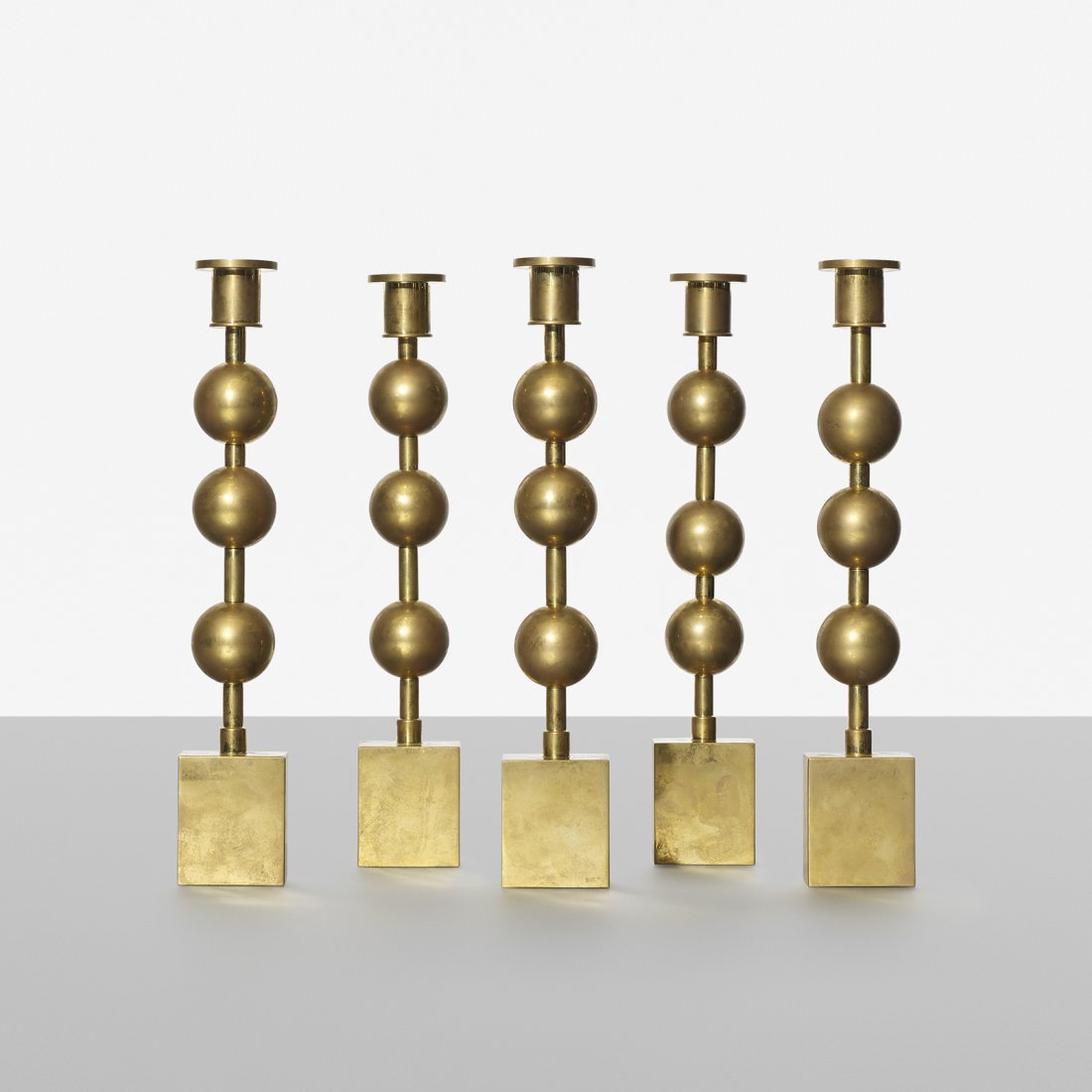 Sigurd Persson candlesticks, set of five: Sigurd Persson candlesticks, set of five Sweden, 1963 brass 2 w x 2 d x 11.25 h inches Signed with impressed manufacturer's mark to lower edge of each example: [Sig. P].