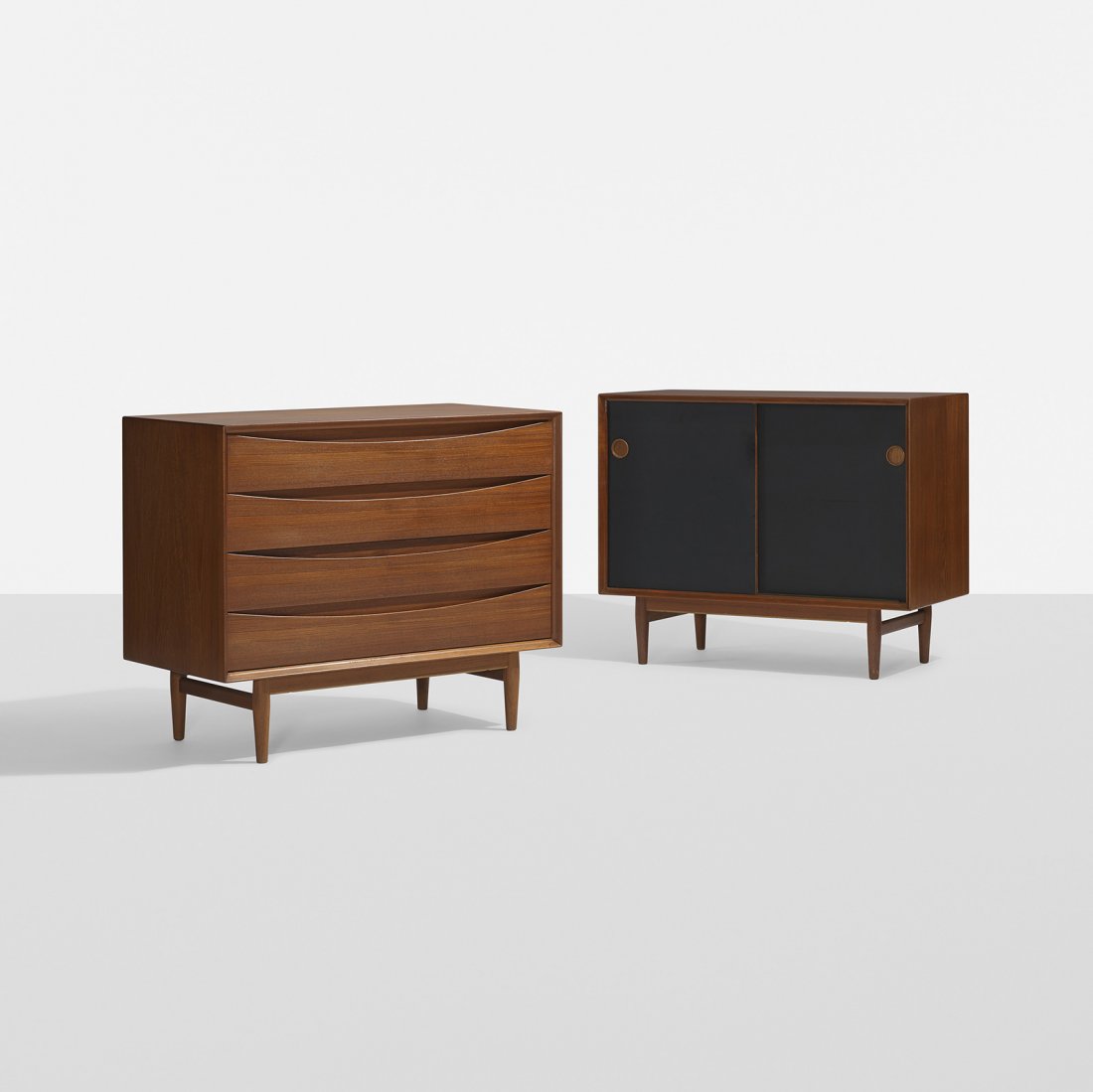 Arne Vodder cabinets, pair: Arne Vodder cabinets, pair Sibast Mobler Denmark, c. 1960 teak, laminate 39 w x 19.5 d x 31.75 h inches One cabinet features four drawers with one removable tray. Additional cabinet features two doors