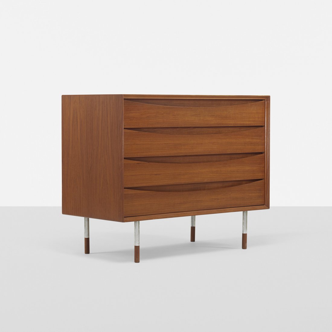 Arne Vodder cabinet: Arne Vodder cabinet Sibast Mobler Denmark, 1960 teak, chrome-plated steel 39.25 w x 19.5 d x 31.75 h inches Signed with applied foil manufacturer's label to drawer: [Sibast Furniture Made in Denmark]