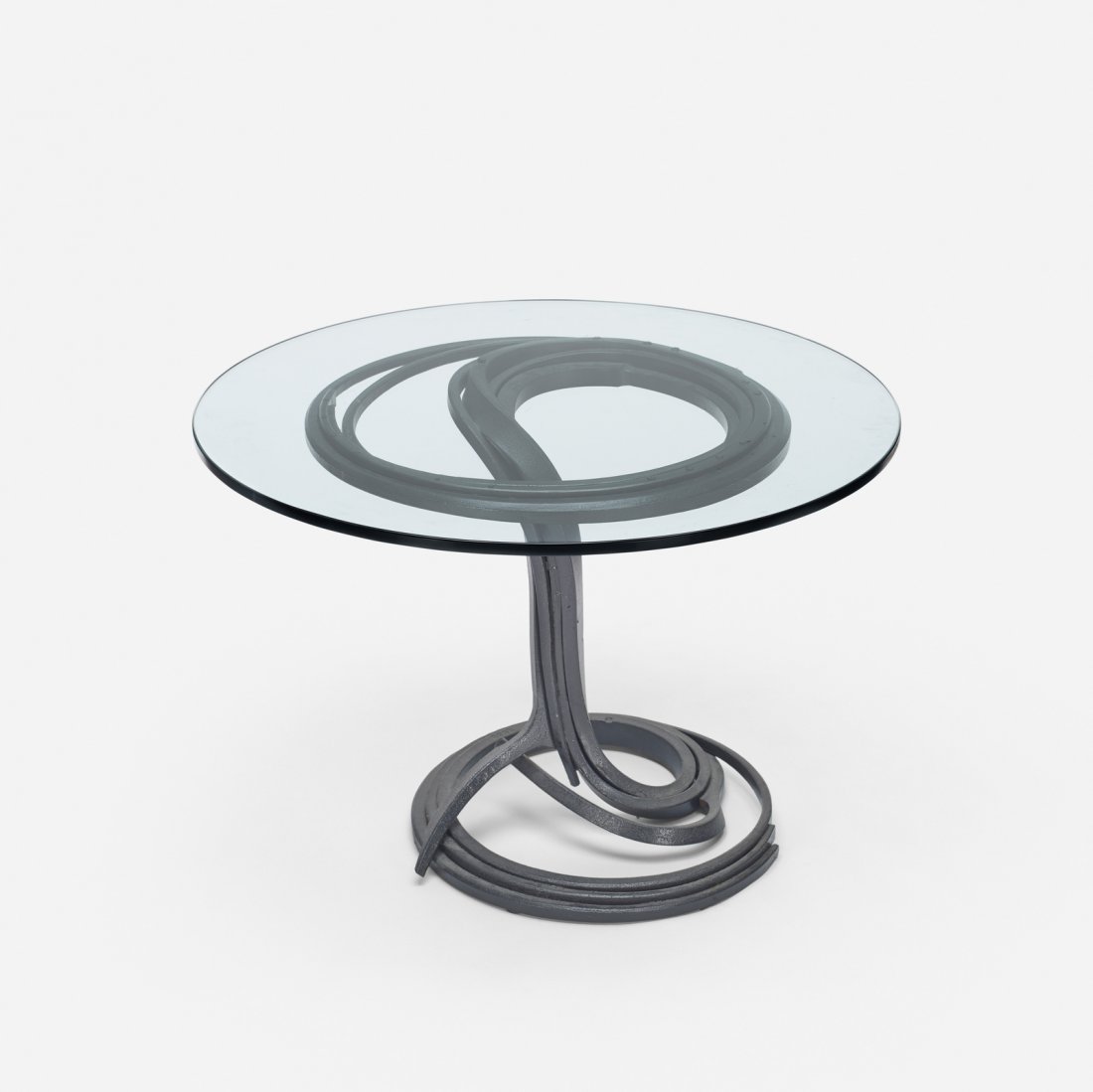 Albert Paley, dining table: Albert Paley dining table USA, 1982forged and painted steel, glass41.75 dia x 29 h in (106 x 74 cm) This work is from a small series of approximately ten tables created for the Fendrick Gallery of