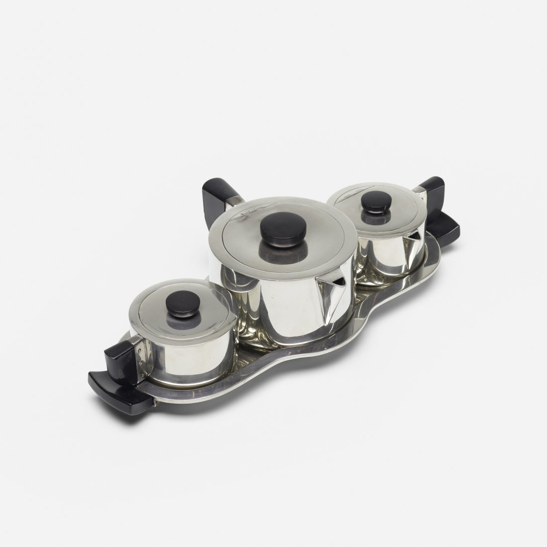 Virginia Hamill, tea service: Virginia Hamill tea service Wilcox Silver Plate Co.USA, c. 1928pewter, Bakelite13.25 w x 6.75 d x 3.5 h in (34 x 17 x 9 cm) Set includes teapot, creamer, sugar bowl and tray. Signed with im