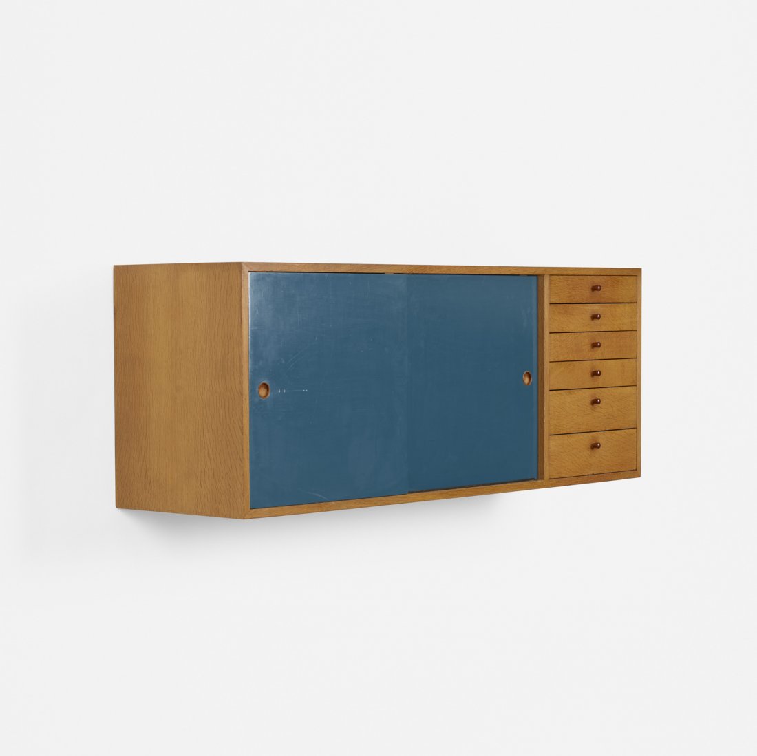 Arne Vodder, wall-mounted cabinet: Arne Vodder wall-mounted cabinet Denmark, c. 1940white oak, lacquered wood, teak21.25 h x 56.75 w x 16.5 d in (54 x 144 x 42 cm) Cabinet features six drawers and two sliding doors concealing