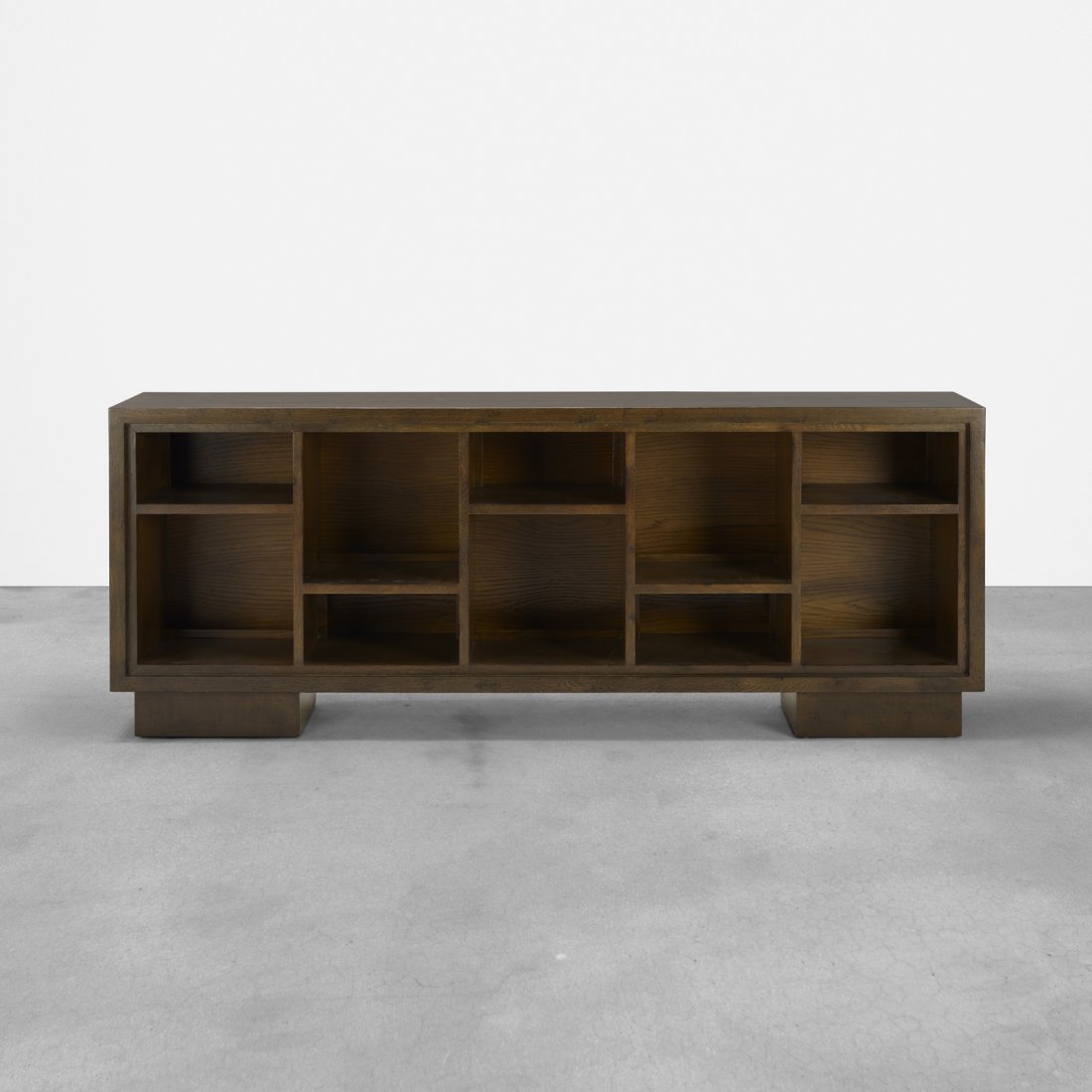 Samuel Marx, bookcase from the Morton D. May House: Samuel Marx bookcase from the Morton D. May House USA, 1940stained oak72 w x 17.75 d x 28 h in (183 x 45 x 71 cm) Provenance: Morton D. May, Ladue, MO | David B. Lichtenstein