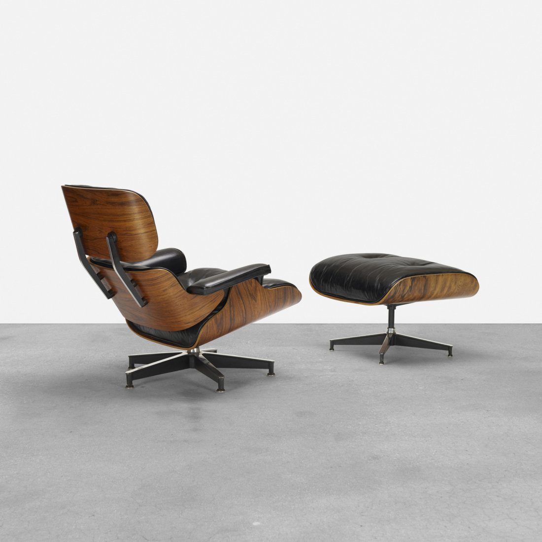 Charles and Ray Eames, 670 lounge chair and 671 ottoman: Charles and Ray Eames 670 lounge chair and 671 ottoman Herman Miller USA, 1956 rosewood plywood, leather, enameled aluminum, rubber, down filling 33 w x 34 d x 32.5 h in (84 x 86 x 83 cm)