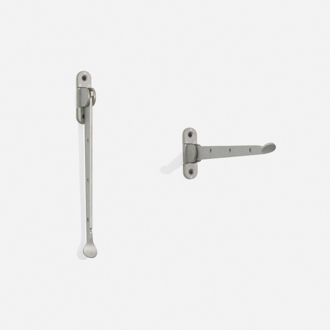 Alfredo Haberli, C. Hooks, pair: Alfredo Haberli C. Hooks, pair DriadeArgentina / Italy, c. 2000cast aluminum1.25 w x 13.25 d x 14.75 h in (3 x 34 x 37 cm) Signed with cast manufacturer's mark to arm and plate: [Driade Sto