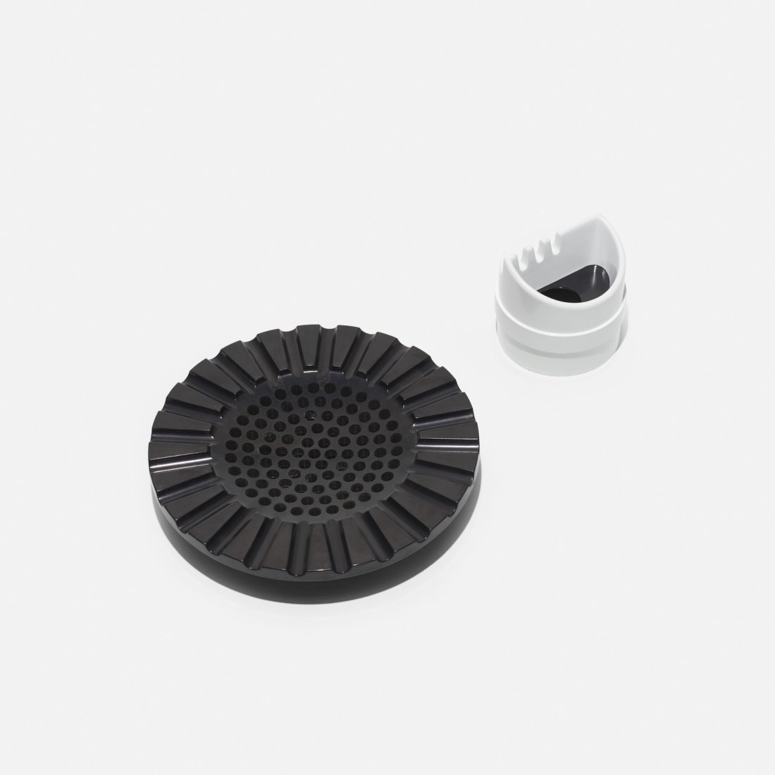 Kartell, ashtrays, set of two: Kartell ashtrays, set of two Italy, 1969-1970 molded plastic 9.75 dia x 1.75 h in (25 x 4 cm) Lot includes ashtray, model 4638 designed by Anna Castelli Ferrieri and ashtray, model 4630 by Joe Colo