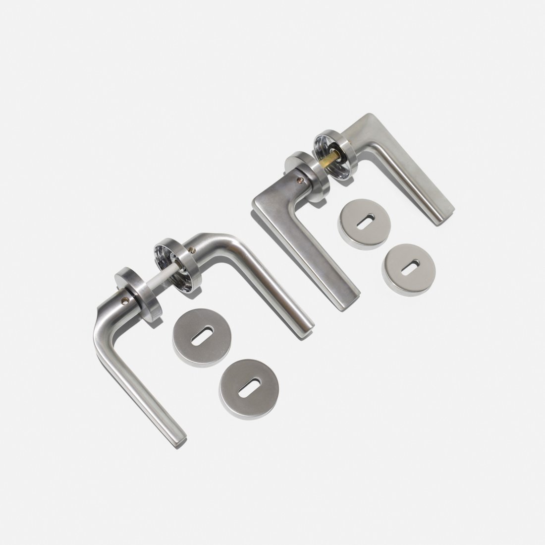 Colombo, door handles, set of two: Colombo door handles, set of two Italy, 1998/2002aluminum Set includes one Gira door handle by Jasper Morrison, 1998 and one Meta door handle by Konstantin Grcic, 2004. Signed with cast m