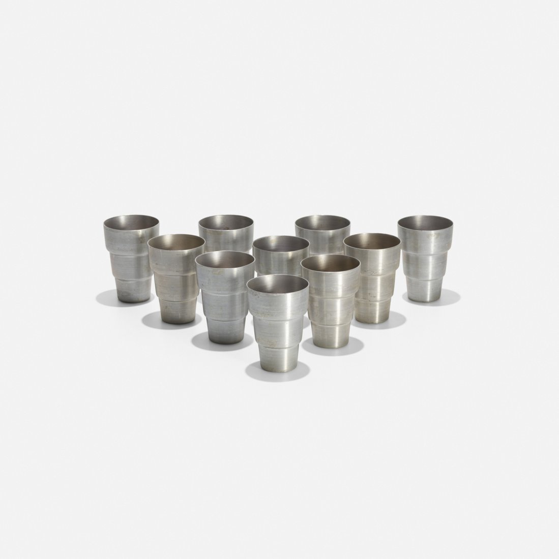 Russel Wright, cups, set of ten: Russel Wright cups, set of ten Russel Wright Inc.USA, c. 1930spun aluminum3 dia x 4.5 h in (8 x 11 cm) Signed with impressed manufacturer's mark to underside of each example: [Russel Wright