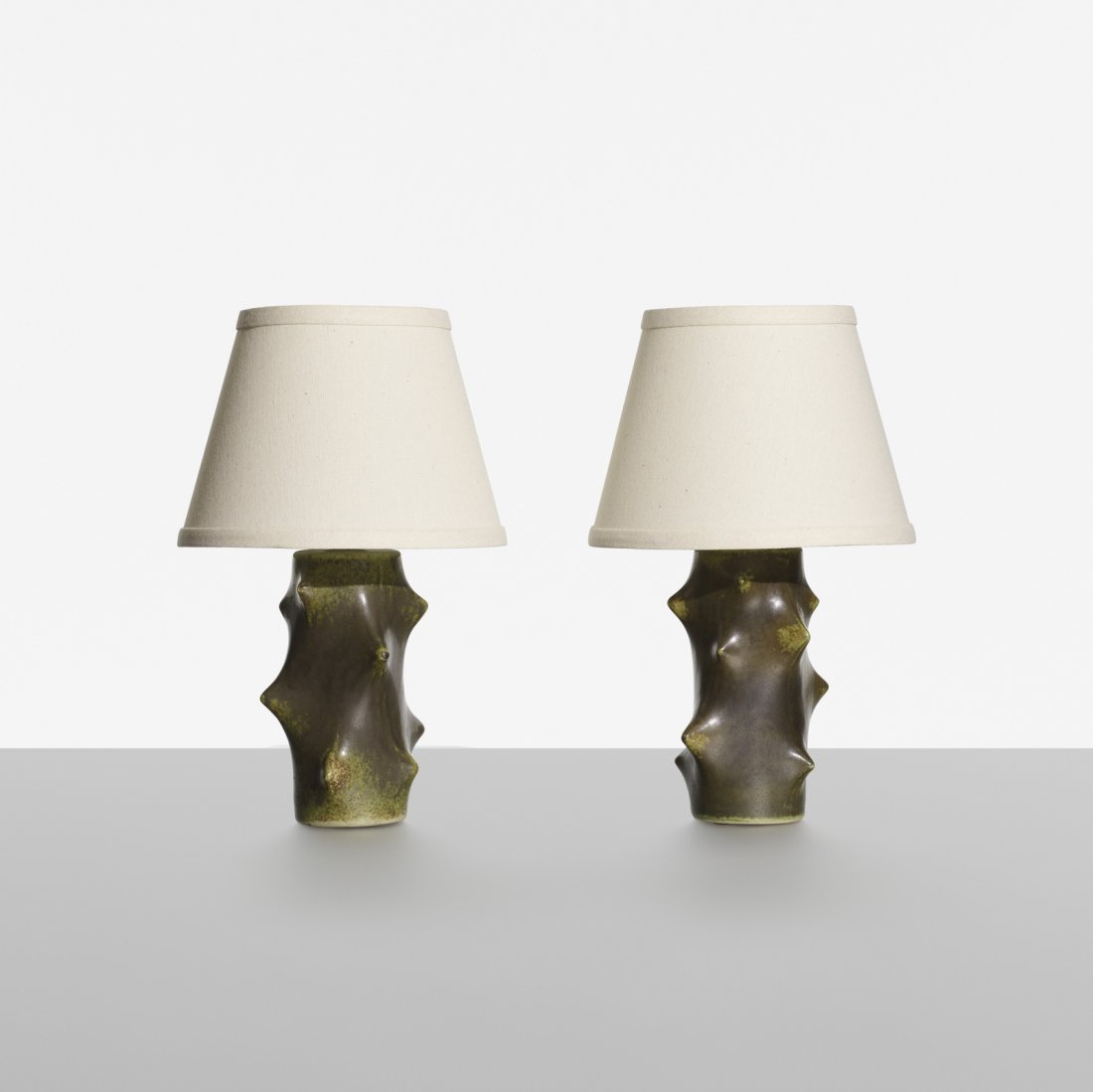 Knud Basse, table lamps, pair: Knud Basse table lamps, pair Michael Andersen & SonDenmark, c. 1955glazed stoneware, linen8.5 dia x 13 h in (22 x 33 cm) Signed with impressed manufacturer's mark to underside of one exampl