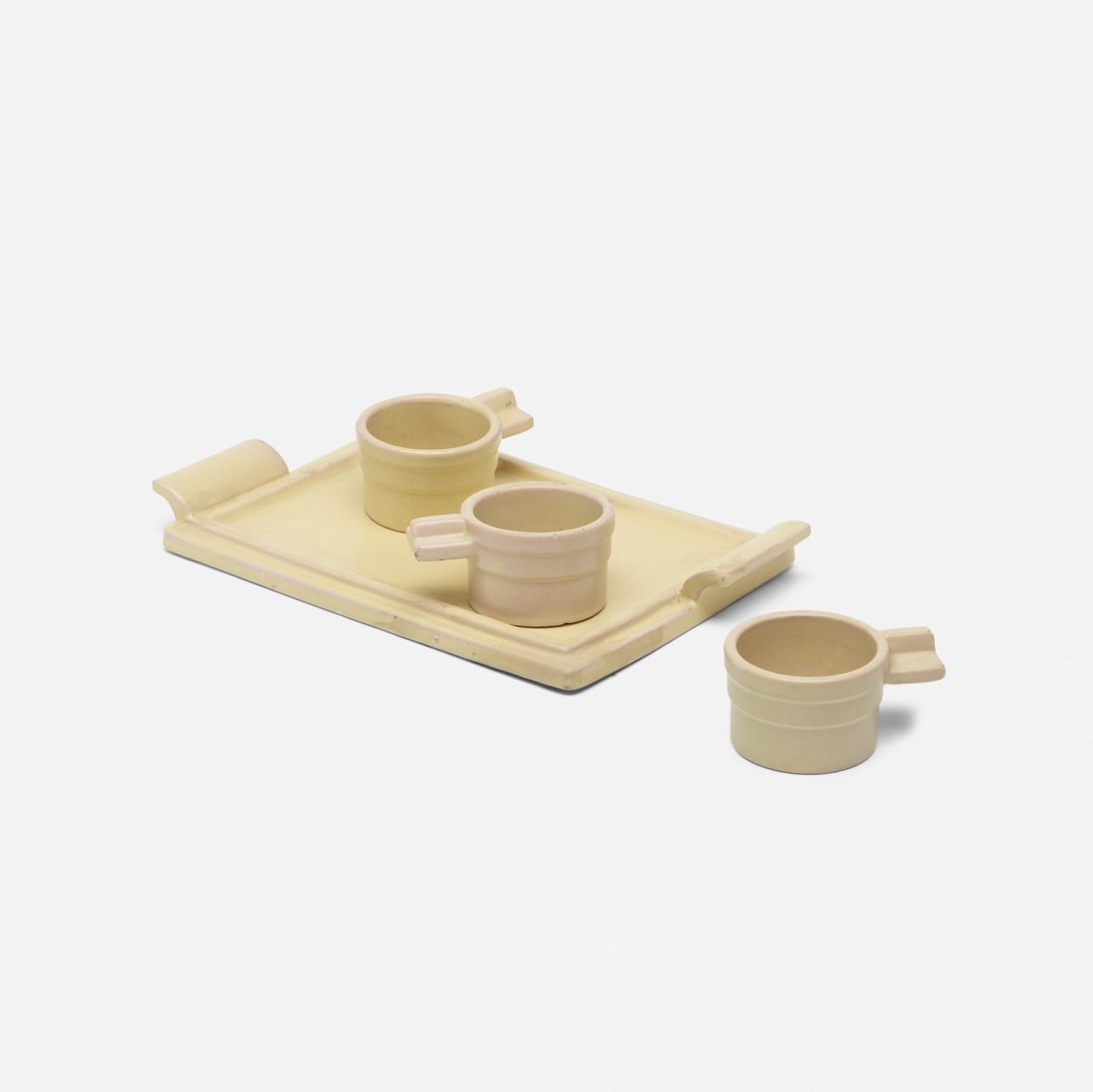 Eva Zeisel, tea glass stands and tray: Eva Zeisel tea glass stands and tray Schramberger MajolikafabrikHungary / Germany, 1929glazed ceramic12.25 w x 7.75 d x 1.25 h in (31 x 20 x 3 cm) Lot includes one tray and three tea glass