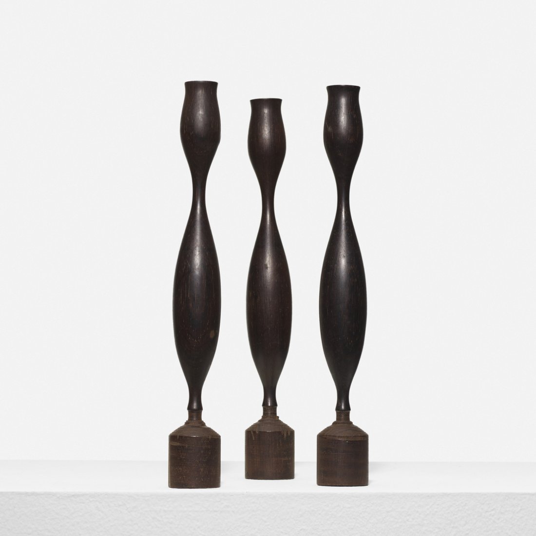 Eva Zeisel, prototype candlesticks, set of three: Eva Zeisel prototype candlesticks, set of three Salisbury ArtisansHungary / USA, 1951turned rosewood1.5 dia x 11.5 h in (4 x 29 cm) Provenance: Collection of the artist