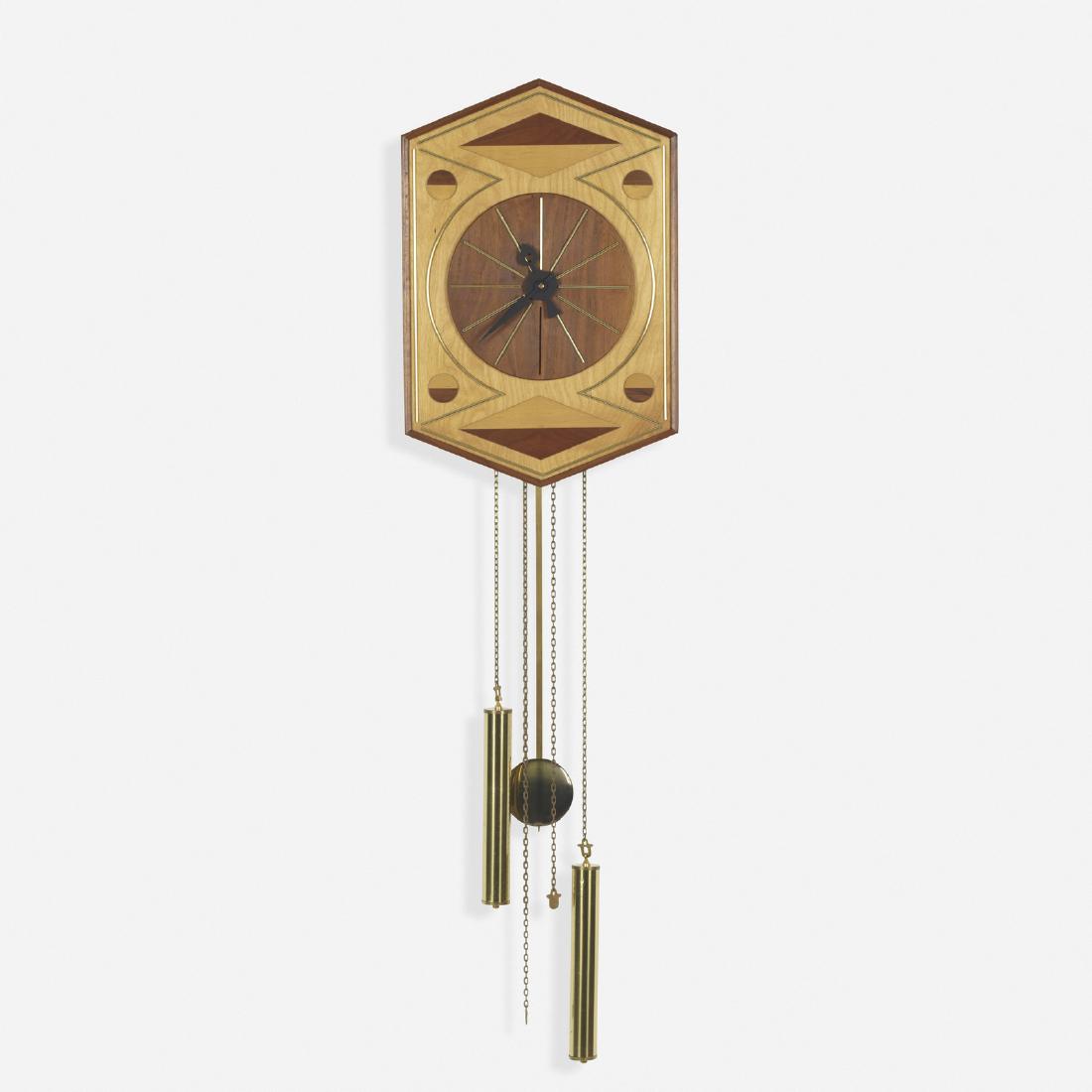 George Nelson & Associates, wall clock, model 2243: George Nelson & Associates wall clock, model 2243 Howard Miller Clock CompanyUSA, 1957walnut, cherry, brass, enameled aluminum12 w x 4 d x 44 h in (30 x 10 x 112 cm) Signed with impressed m