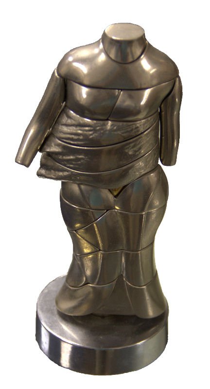 Miguel Ortiz Berrocal (SPANISH, 1933 - 2006) Sculpture: Miguel Ortiz Berrocal (SPANISH, 1933 - 2006) interlocking mini puzzle sculpture depicting a partially nude female torso. Crafted of nickel plated and brass pieces circa 1968. Titled “Le Mini Cariati