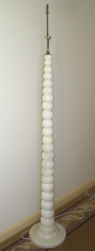 White Marble Floor Lamp: White marlble floor lamp depicting a stack of whtie balls one on top of the other showing the bigger one on bottom and gradually getting smaller as it gets to the top floor approx measures 62" height