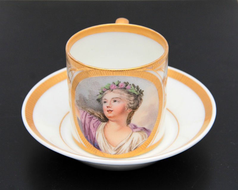 SEVRES FRENCH PORCELAIN HAND PAINTED PORTRAIT CUP &: Sevres French porcelain hand painted cup and saucer depicting the portrait of a young beauty. Measures approx. 2 3/4" height.