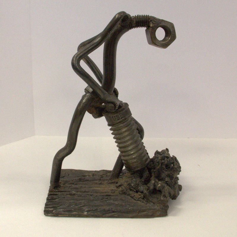 F. Russo Nuts and Bolts sculpture: Vintage nuts and bolts sculpture of a man with jackhammer. Signed F. Russo measures 9 1/2" High x 7 1/4" Long x 4 1/2" wide approximately.